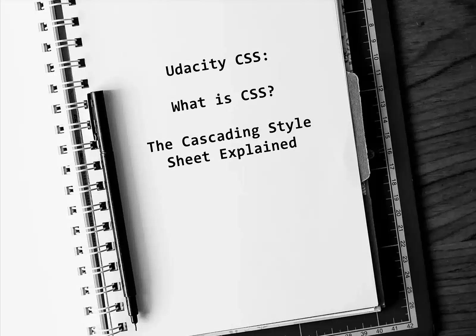 Notebook image with text asking what is CSS Cascading style sheets explained